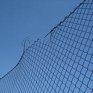 102792-stock-photo-sky-blue-broken-fence-wire-destruction