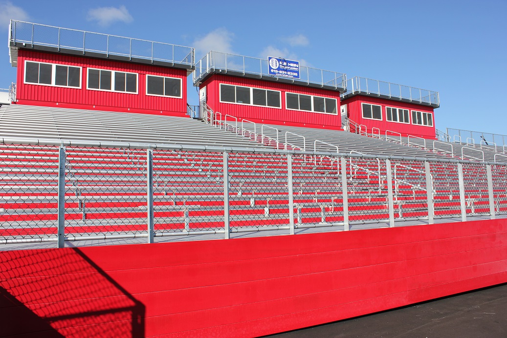 What is the difference between Grandstands and Stadium Bleachers?