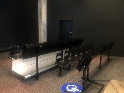 Image of customized bench seating with tablets attached.