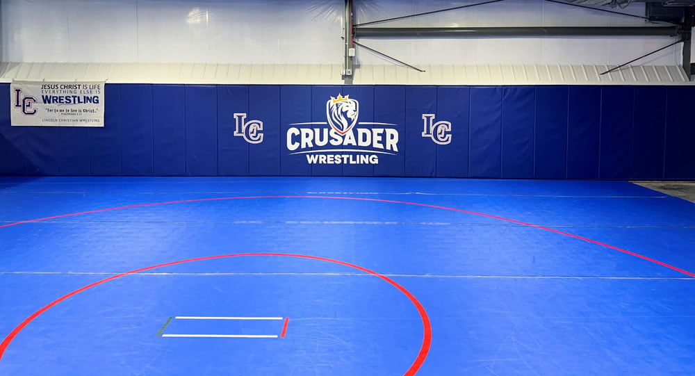 Lincoln-Christian-wrestling-room-padding-with-logo