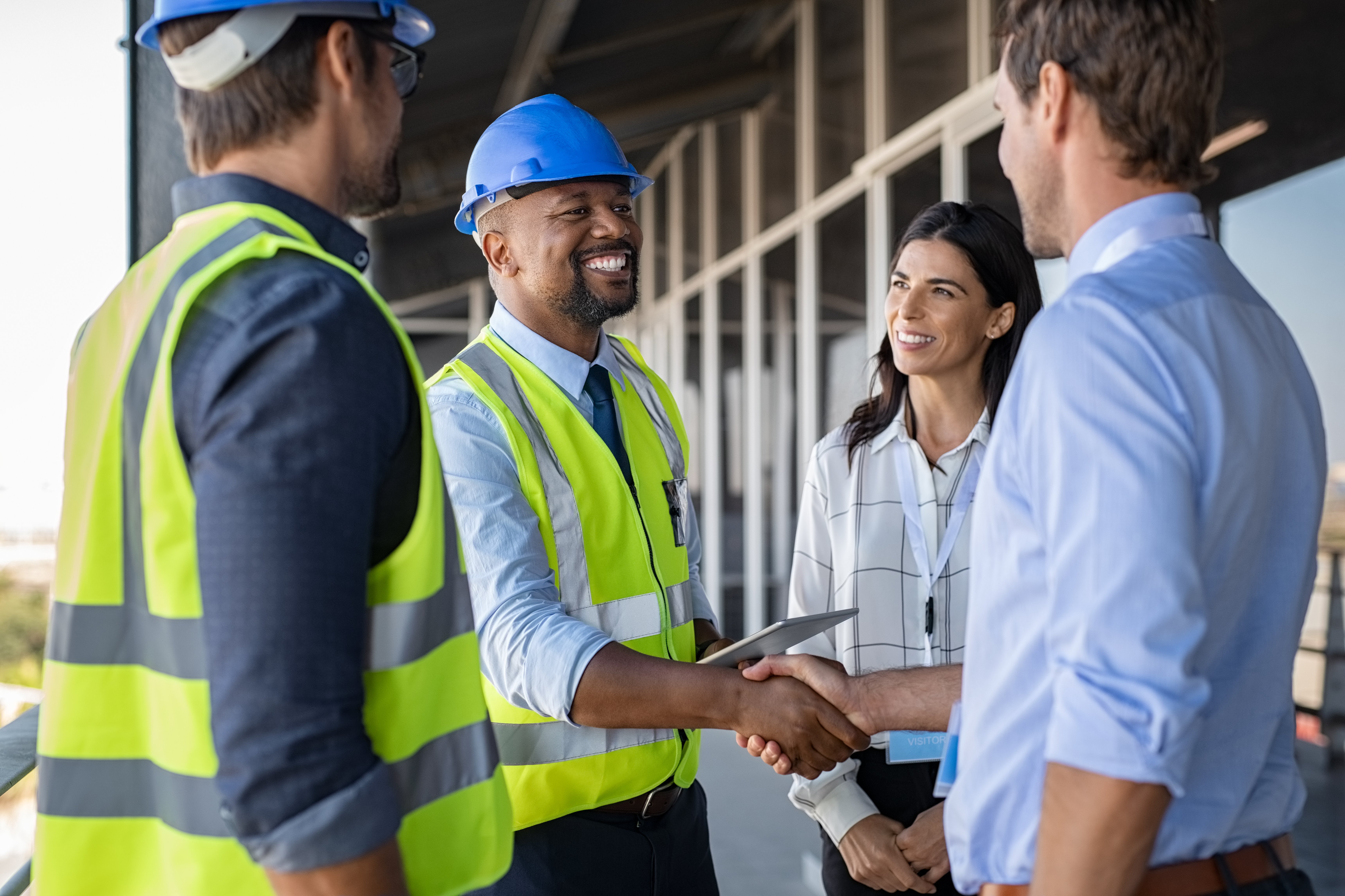 engineer-and-businessman-handshake-at-construction-2021-08-27-09-43-33-utc